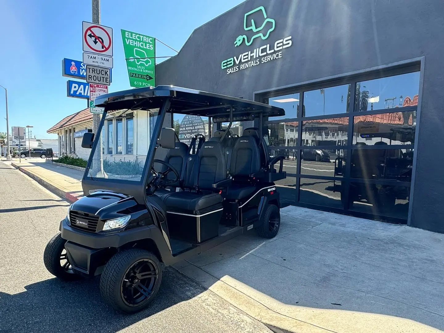 An electric vehicle parked outside the E3 Vehicles shop on Pacific Coast Highway